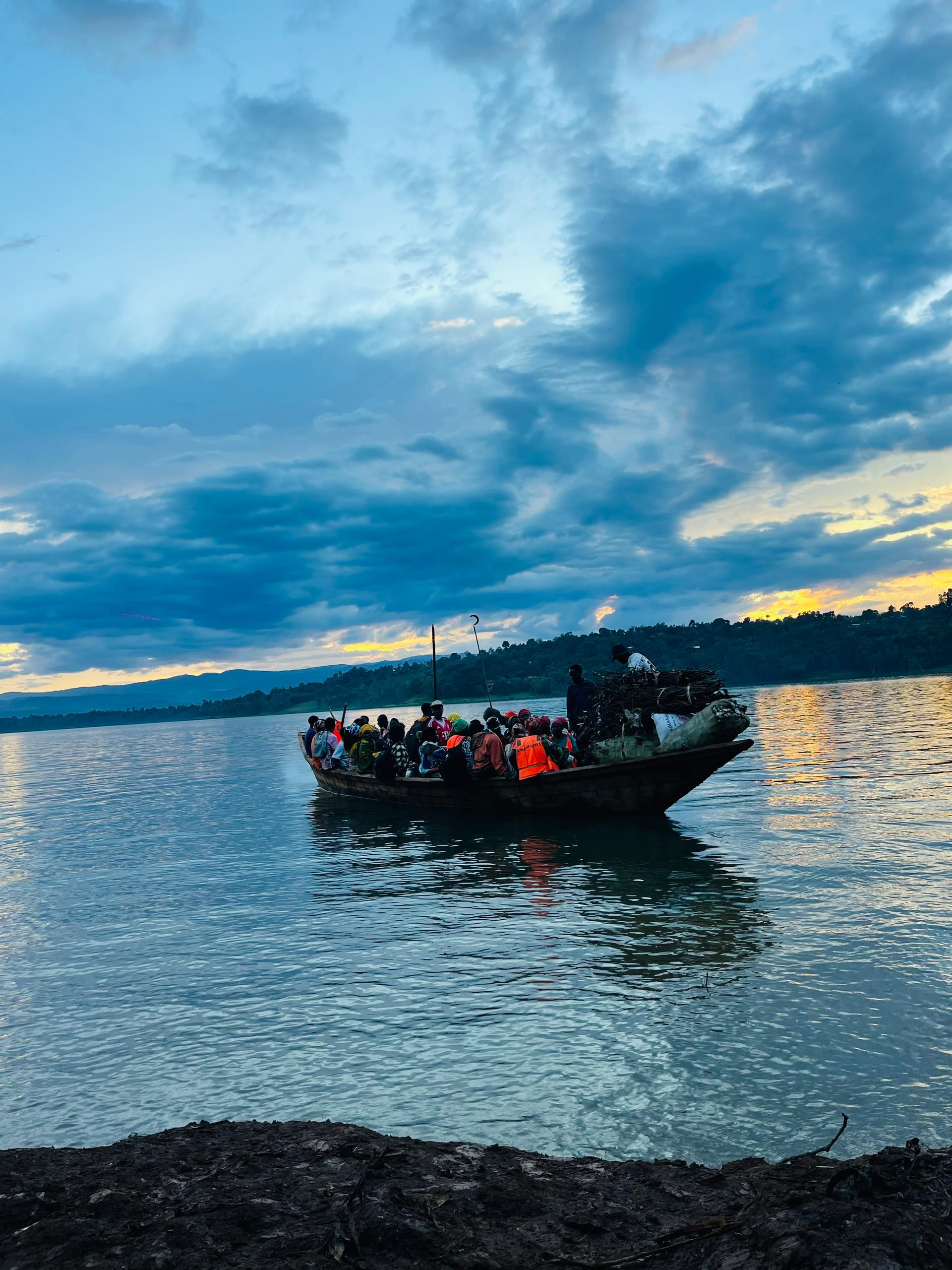 A loaded wooden boat crossing Lake Kivu near Rusizi, Rwanda.